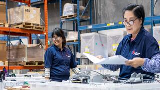 Two IEM Employees working together