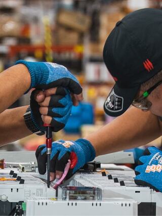 Two IEM employees working with equipment